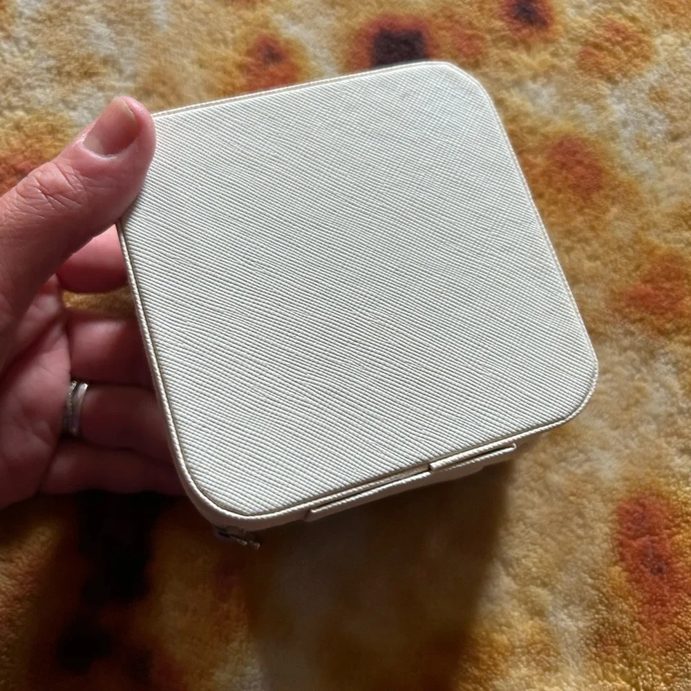 Small square white travel Monogramed jewelry box with a Pink K on the front